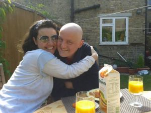 Mariacristina and George enjoying a sunny breakfast in the garden